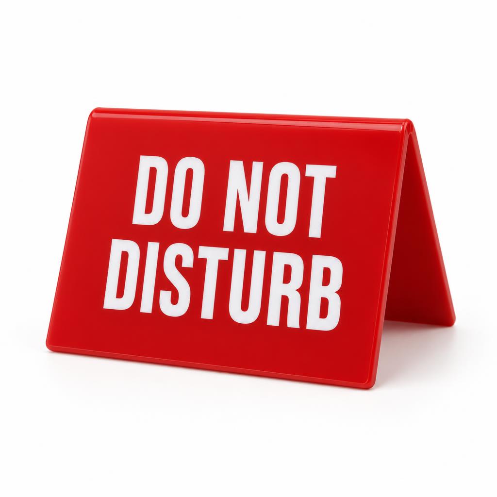 'Do Not Disturb' red tent-fold desk sign with white lettering