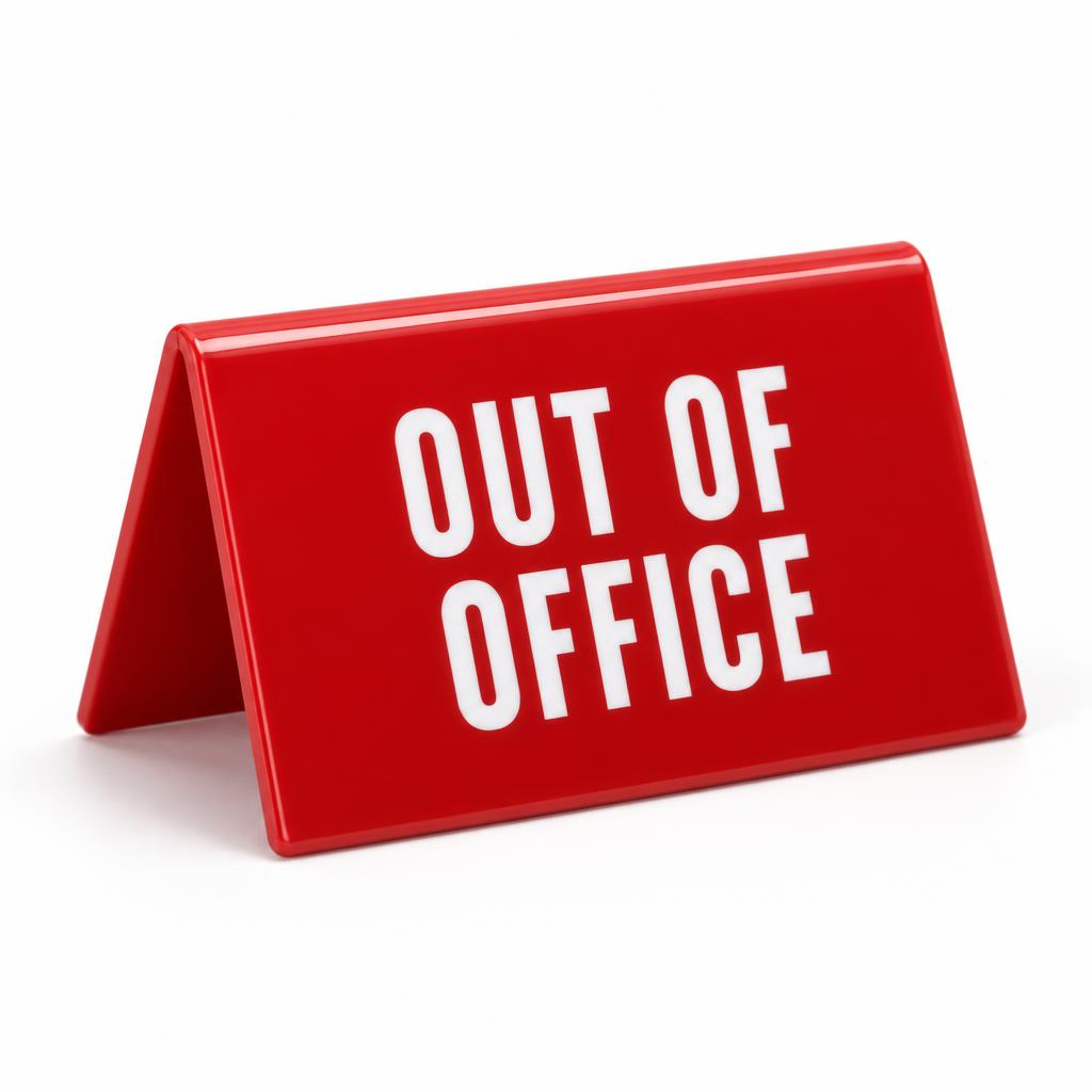 'Out of Office' red tent-fold desk sign with white lettering
